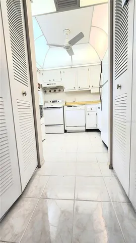 a view of a kitchen with appliances and cabinets