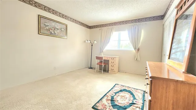 a bed room with a bed and a window