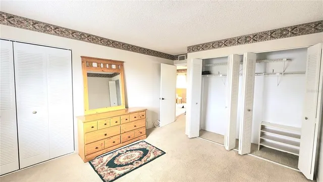wooden floor with white walls and windows