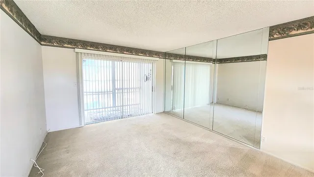 a view of a room with a glass shower door