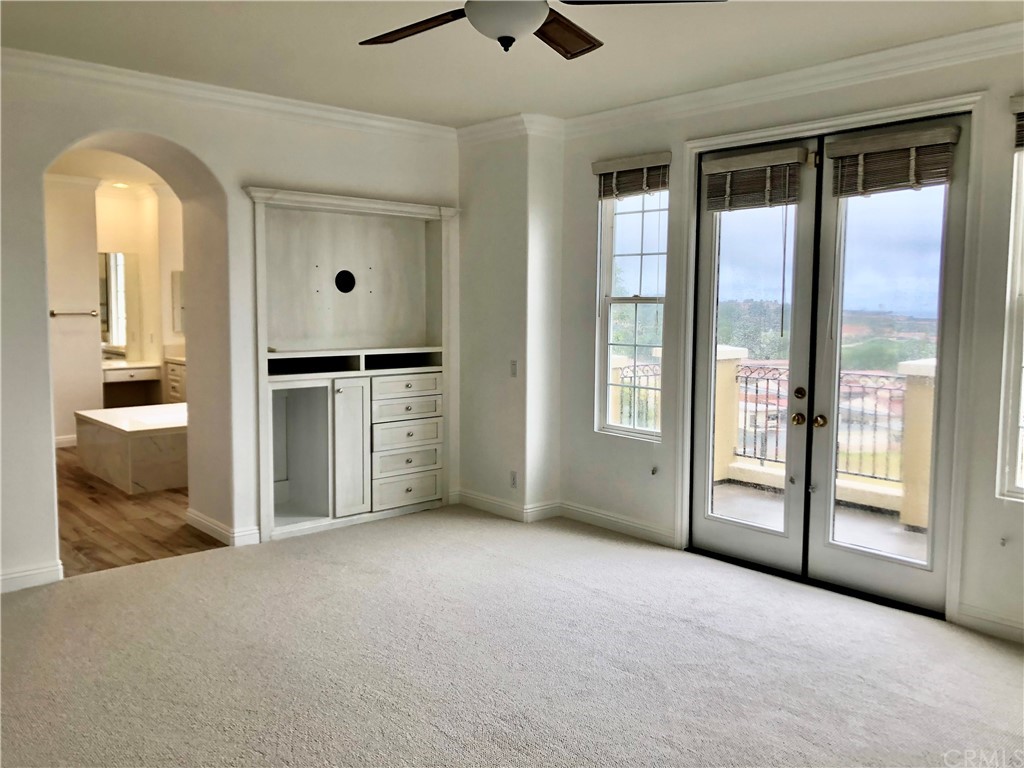 24 Tesoro Newport Coast, CA 92657 - Photo 18 of 20 a view of an empty room with a fireplace and a window