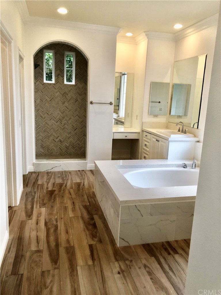 24 Tesoro Newport Coast, CA 92657 - Photo 19 of 20 a bathroom with a tub sink and mirror