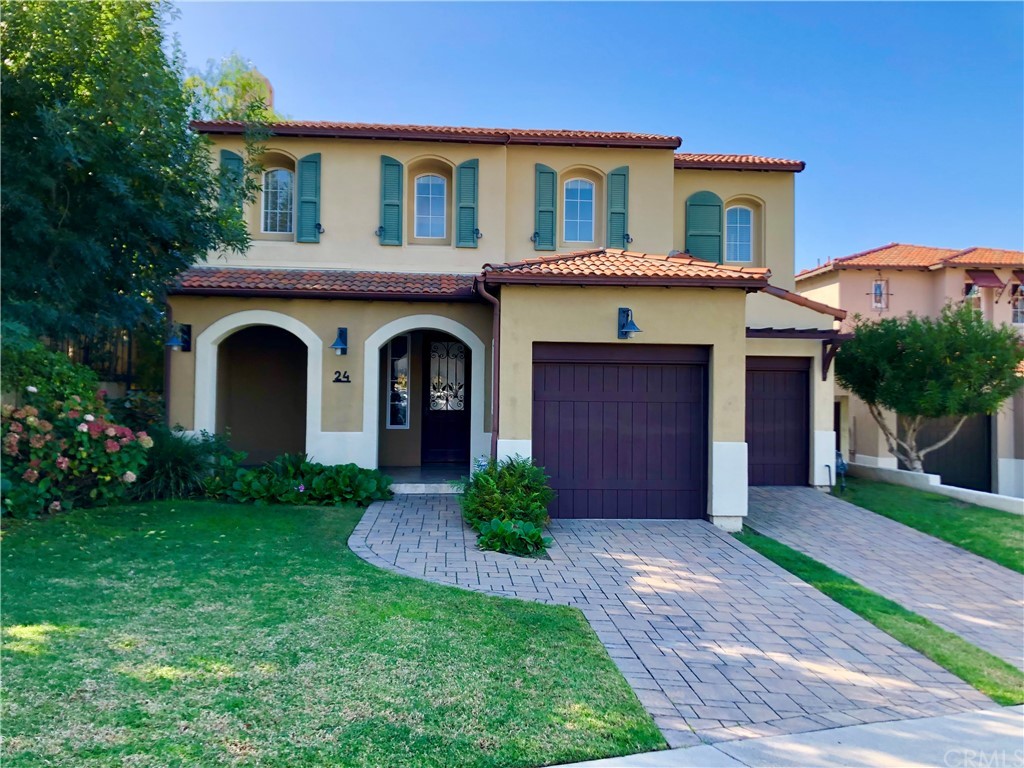 24 Tesoro Newport Coast, CA 92657 - Photo 2 of 20 a front view of a house with a garden