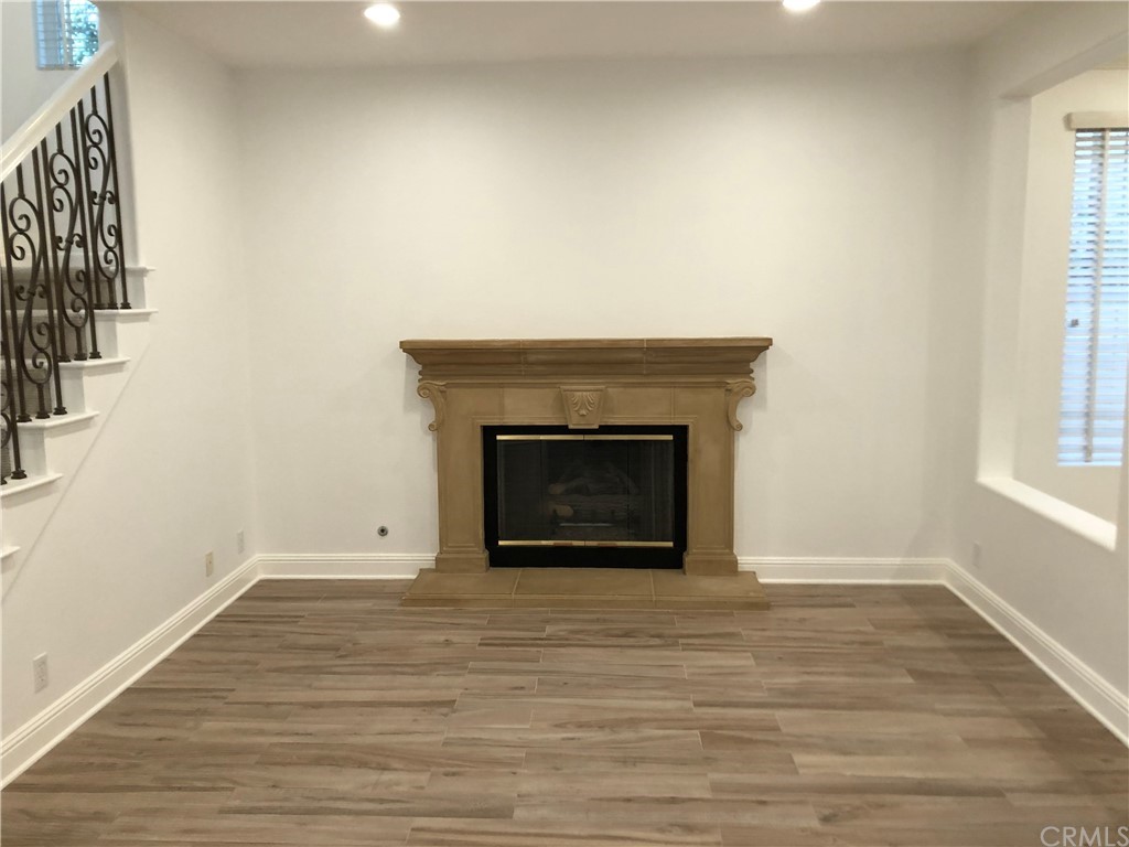 24 Tesoro Newport Coast, CA 92657 - Photo 4 of 20 a view of an empty room with wooden floor and a window