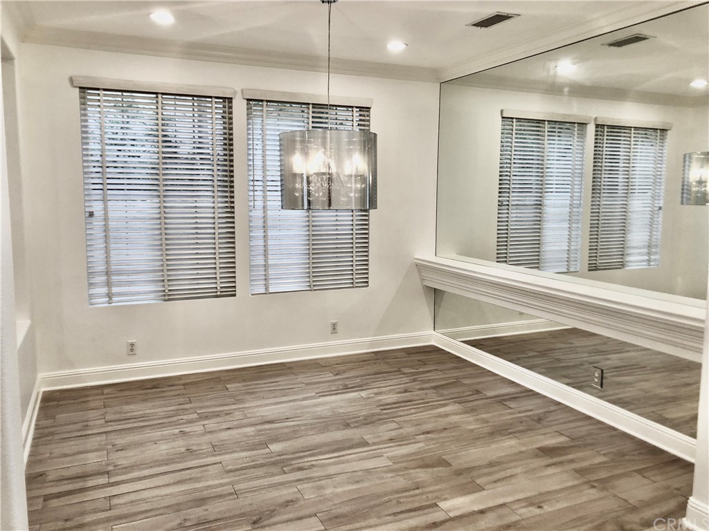 24 Tesoro Newport Coast, CA 92657 - Photo 5 of 20 an empty room with wooden floor and windows