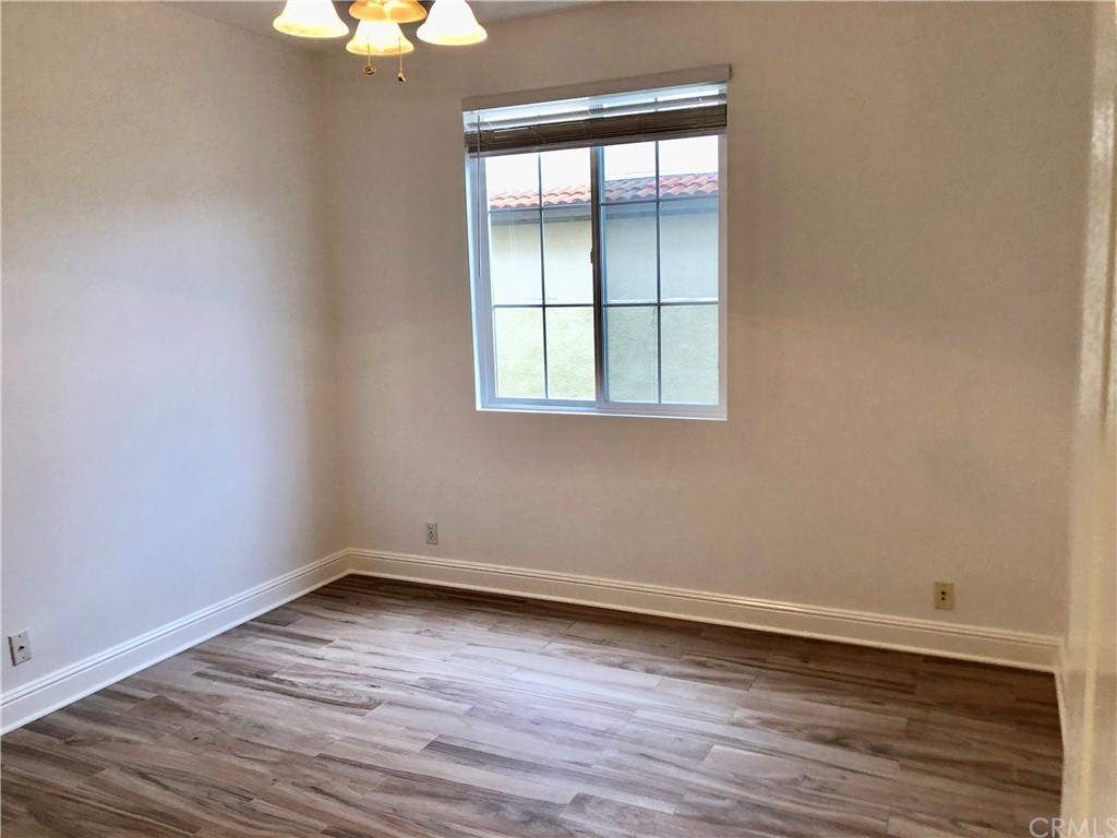 24 Tesoro Newport Coast, CA 92657 - Photo 10 of 20 an empty room with wooden floor and windows