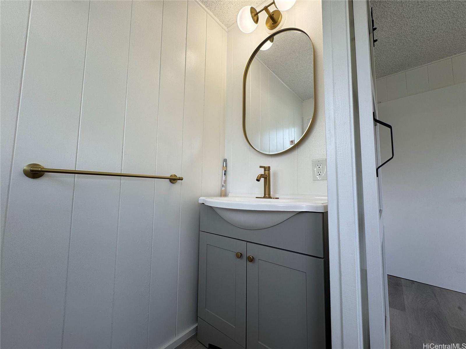 2326 Rose Street Honolulu, HI 96819 - Photo 16 of 19 a bathroom with a sink and a mirror