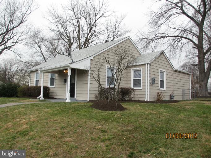 2801 Sheraton Street Silver Spring, MD 20906 - Photo 15 of 15 a front view of a house with a garden and trees