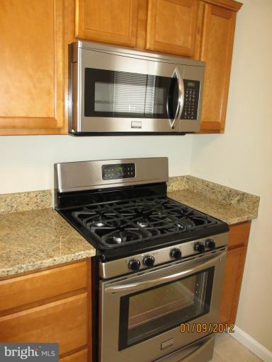 2801 Sheraton Street Silver Spring, MD 20906 - Photo 8 of 15 a stove top oven sitting inside of a kitchen