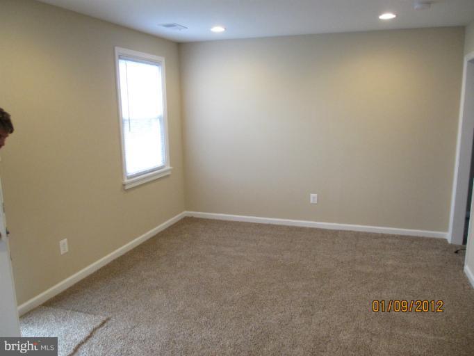 2801 Sheraton Street Silver Spring, MD 20906 - Photo 9 of 15 an empty room with a window