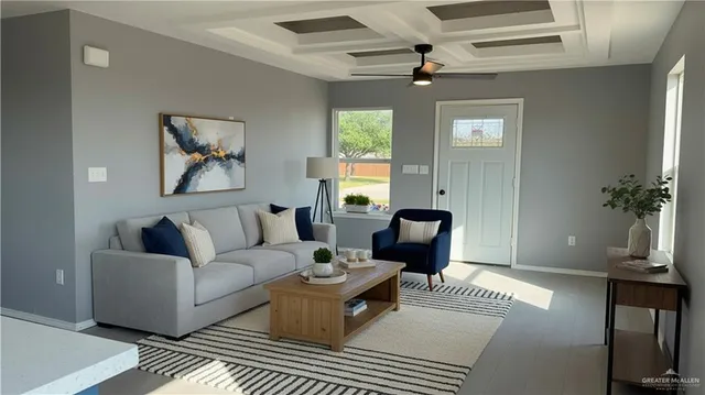 a living room with furniture a chandelier and a window