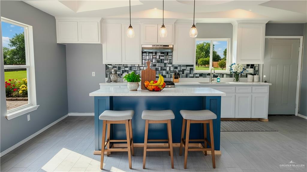 14613 Santa Rita Avenue Mercedes, TX 78570 - Photo 5 of 13 a dining table with stainless steel appliances kitchen island granite countertop furniture and a window