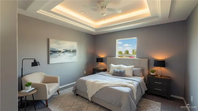 a bedroom with a bed and a painting on the wall