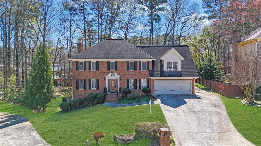 5010 Oak Tree Lane Stone Mountain, GA 30087 - Photo 1 of 35 front view of a house with a yard