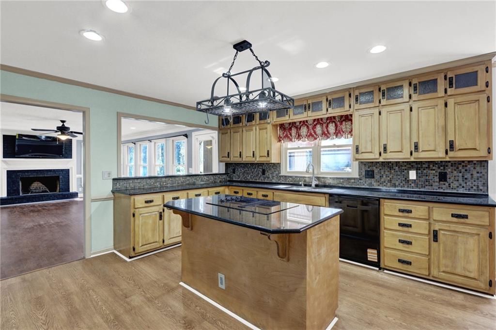 5010 Oak Tree Lane Stone Mountain, GA 30087 - Photo 11 of 35 a kitchen with a stove a sink and a refrigerator