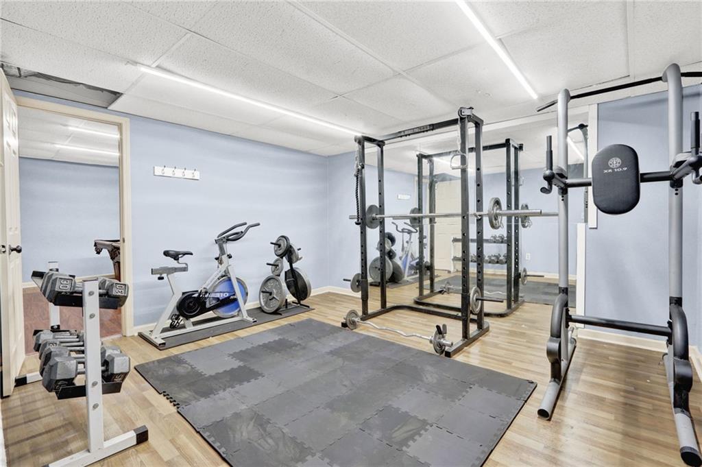 5010 Oak Tree Lane Stone Mountain, GA 30087 - Photo 27 of 35 a view of a room with gym equipment