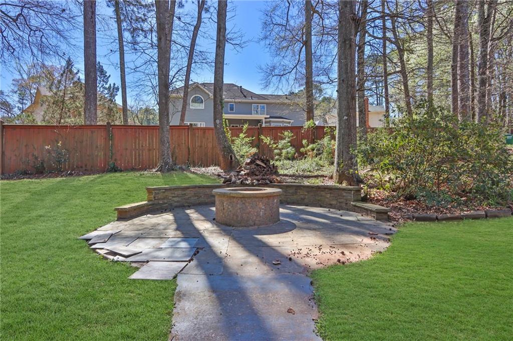 5010 Oak Tree Lane Stone Mountain, GA 30087 - Photo 33 of 35 a view of a backyard with plants and garden