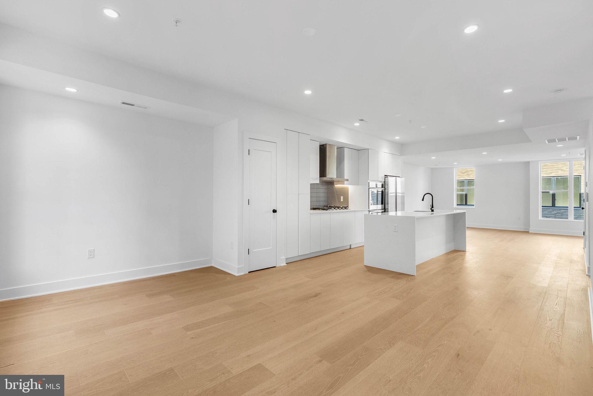 a view of kitchen with wooden floor