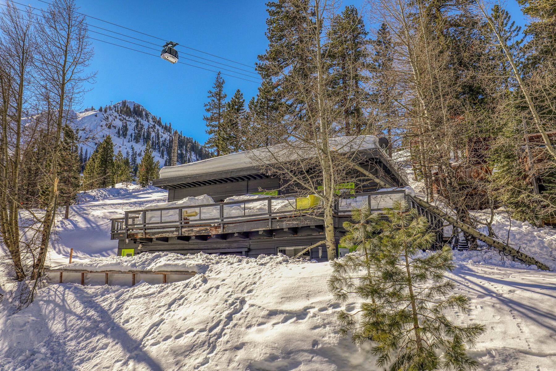 233 Granite Chief Road Olympic Valley, CA 96146 - Photo 1 of 21 a view of a house with a yard covered in snow