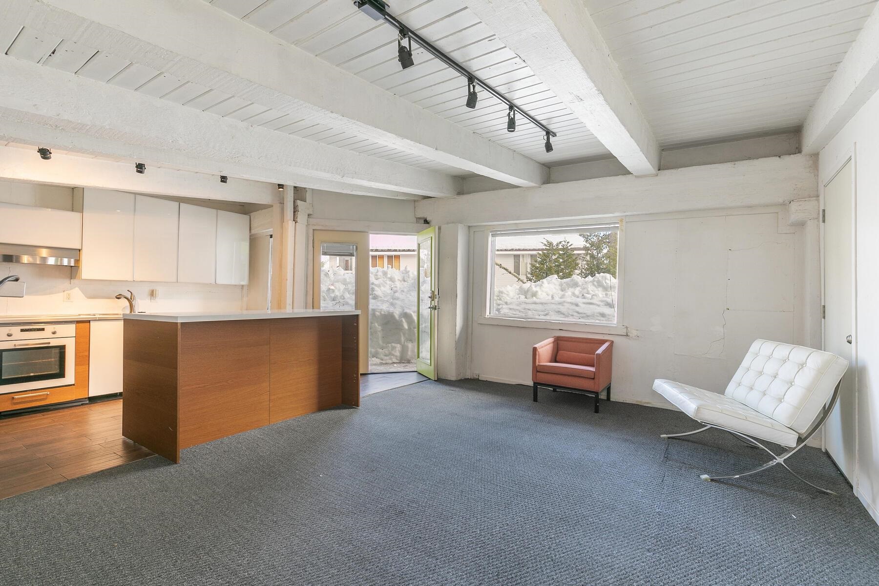 233 Granite Chief Road Olympic Valley, CA 96146 - Photo 11 of 21 a living room with furniture and a open kitchen view