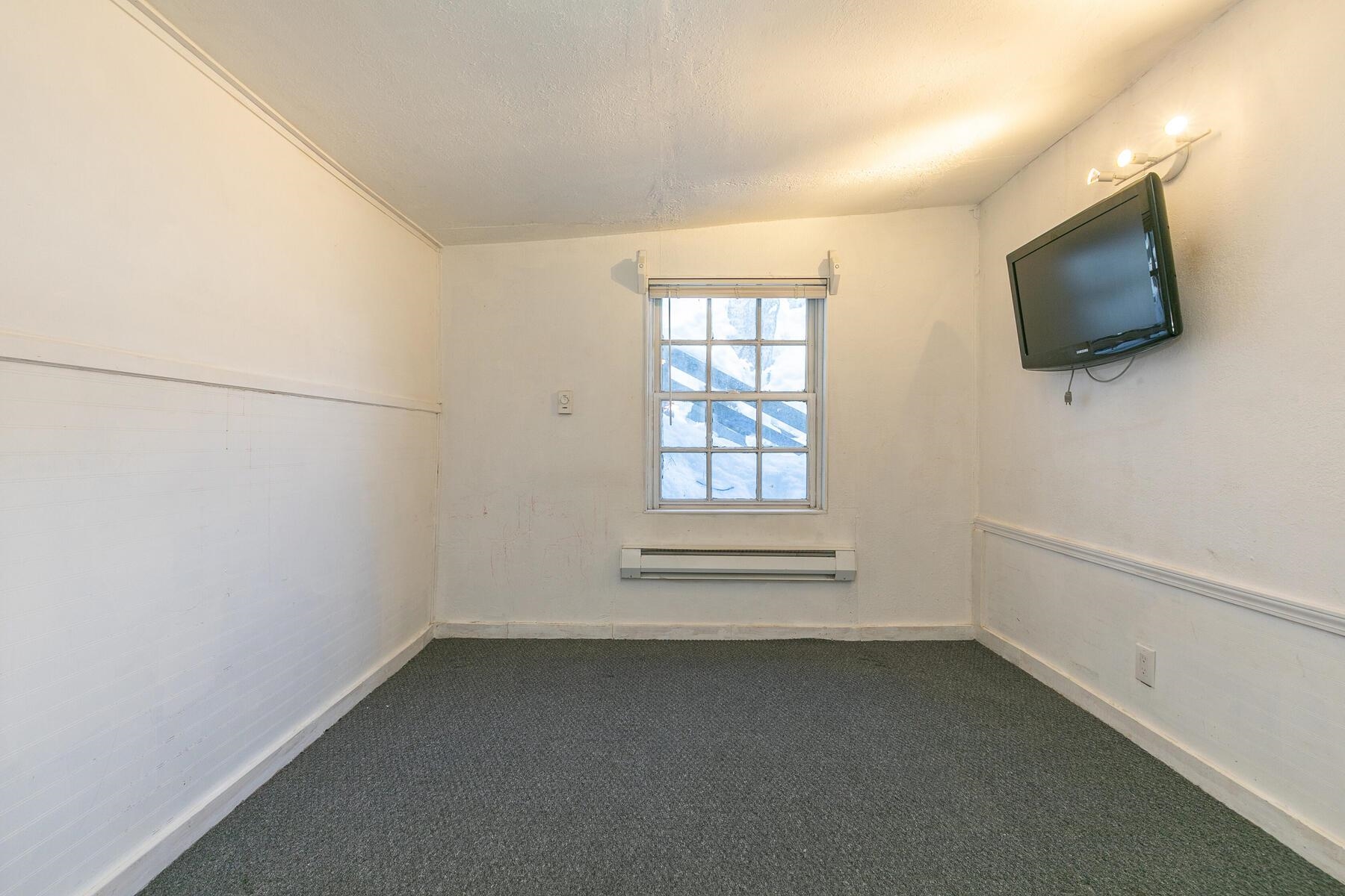 233 Granite Chief Road Olympic Valley, CA 96146 - Photo 13 of 21 a view of room with flat screen tv and windows