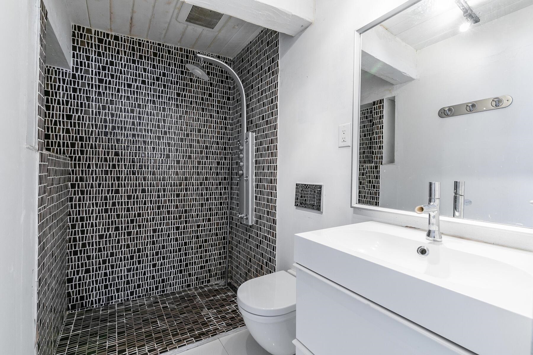 233 Granite Chief Road Olympic Valley, CA 96146 - Photo 19 of 21 a bathroom with a sink toilet and shower