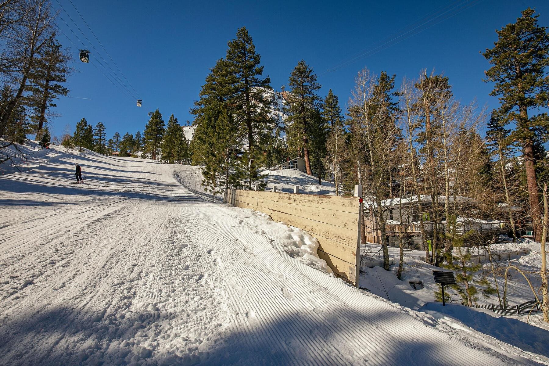 233 Granite Chief Road Olympic Valley, CA 96146 - Photo 3 of 21 a view of a yard with snow on the road