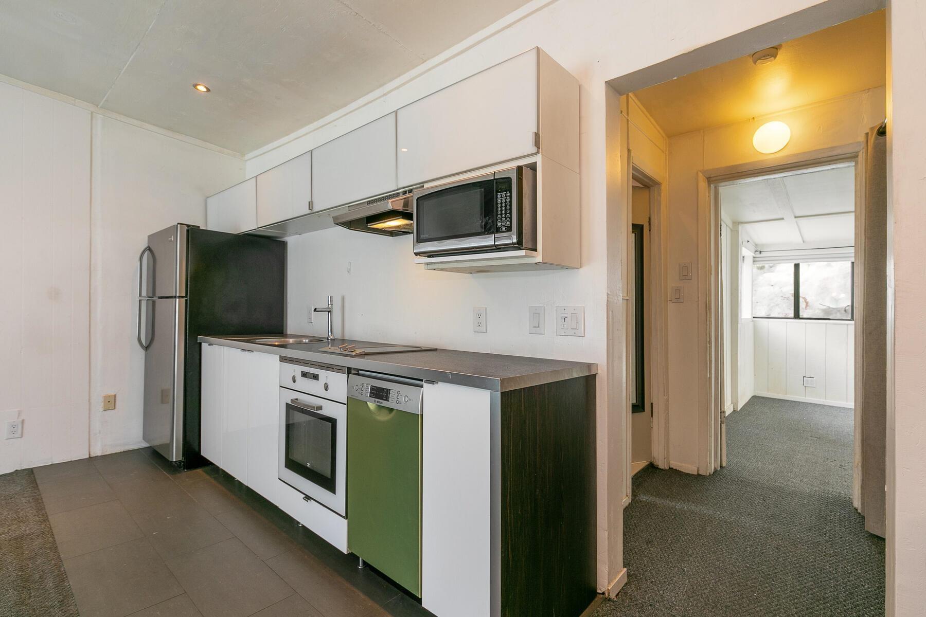 233 Granite Chief Road Olympic Valley, CA 96146 - Photo 8 of 21 a kitchen with a stove and a microwave