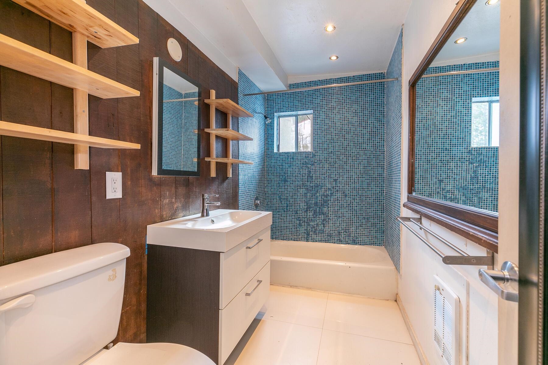 233 Granite Chief Road Olympic Valley, CA 96146 - Photo 9 of 21 a bathroom with a sink toilet vanity and tub
