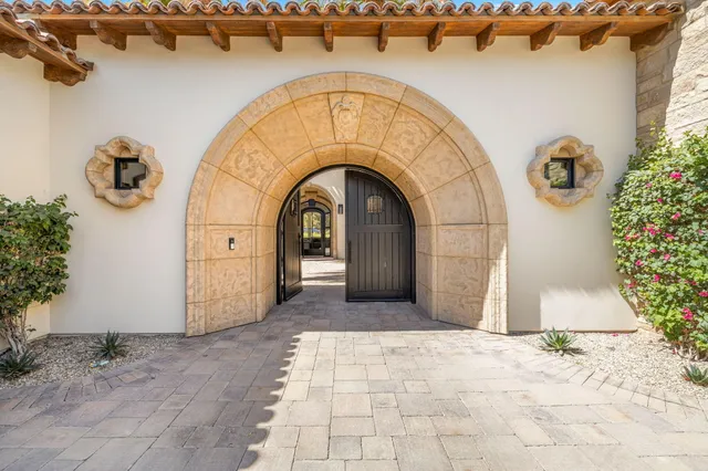 a bedroom with a bed and a chair