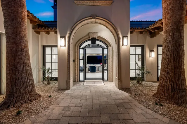 a bathroom with a granite countertop sink a large mirror and a shower
