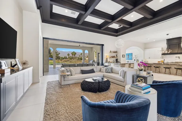 a living room with furniture fireplace and flat screen tv