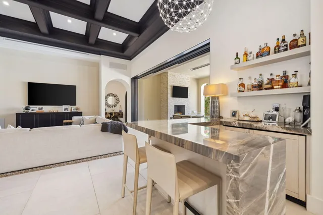 a view of a swimming pool with a patio and a yard