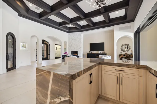 a view of swimming pool with seating area and city view