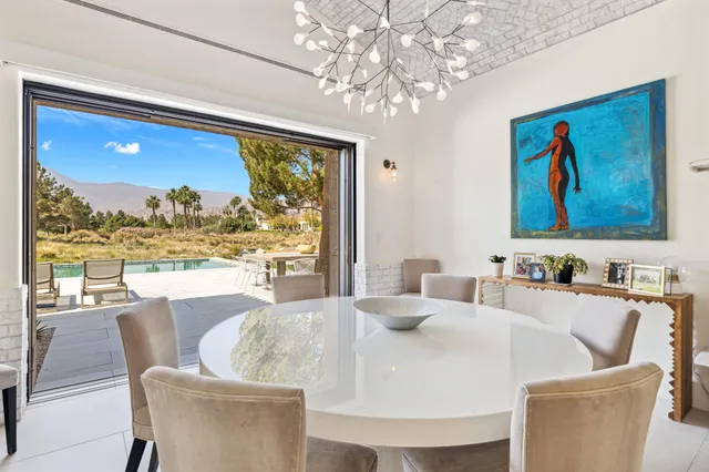 a view of a lake with a houses in the background