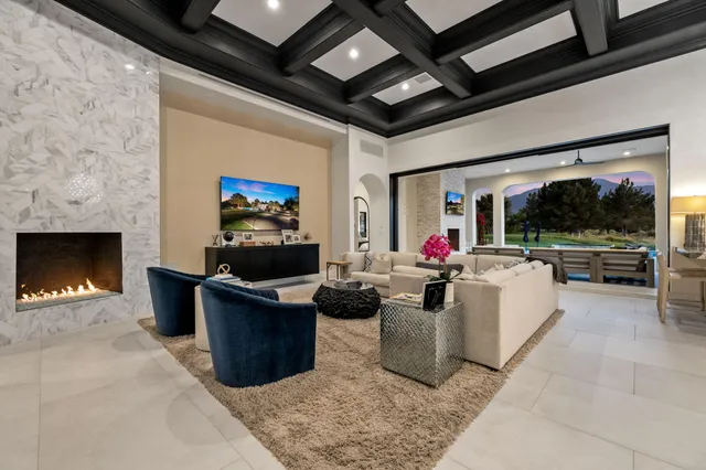 a large kitchen with stainless steel appliances kitchen island granite countertop a sink and cabinets