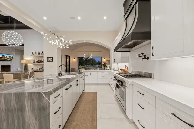 a spacious bedroom with a bed and furniture