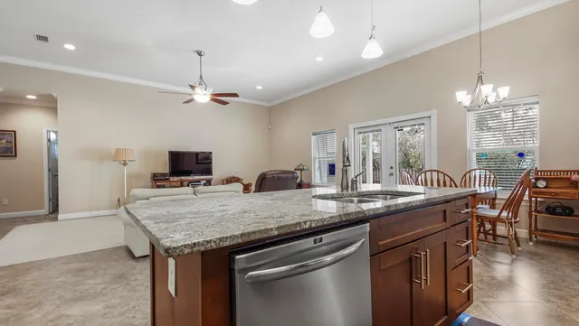 a kitchen with a counter space a sink and appliances