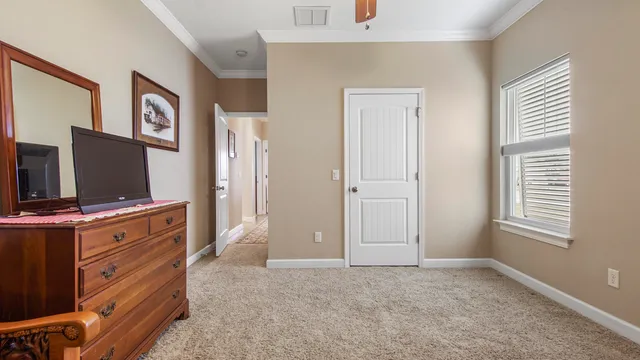 a livingroom with window and flat screen tv