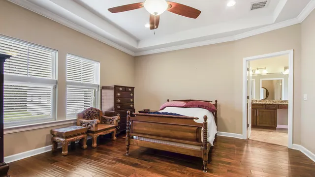 a bedroom with furniture and a window