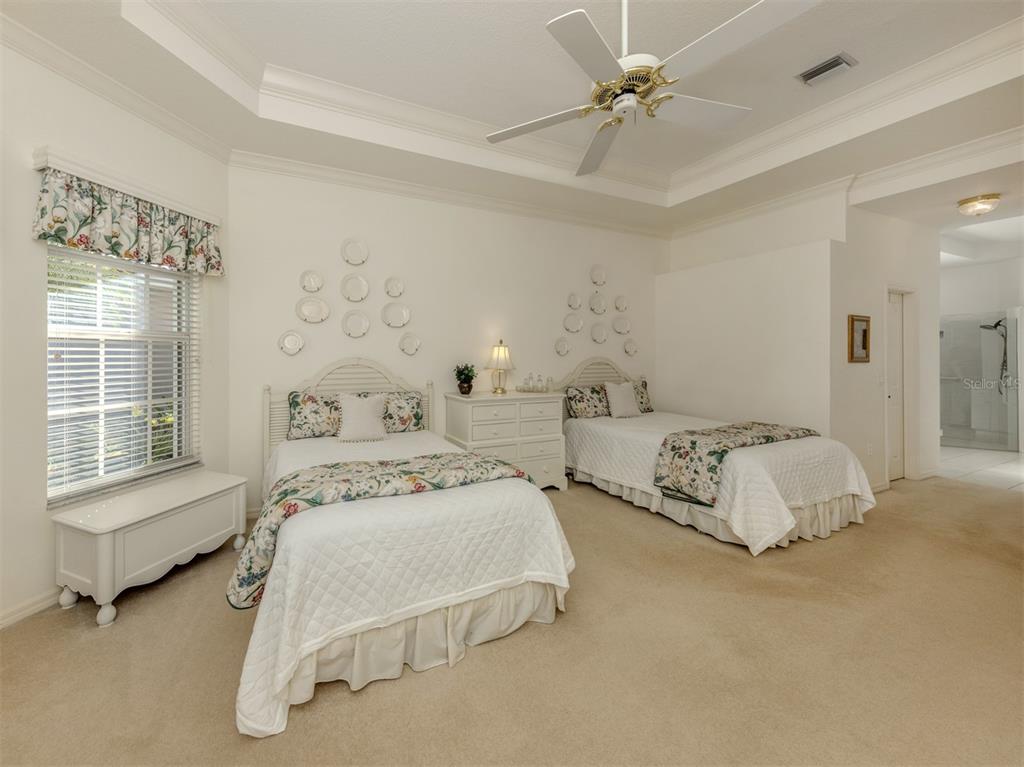 764 Sawgrass Bridge Road Venice, FL 34292 - Photo 18 of 60 a bedroom with two beds and a window