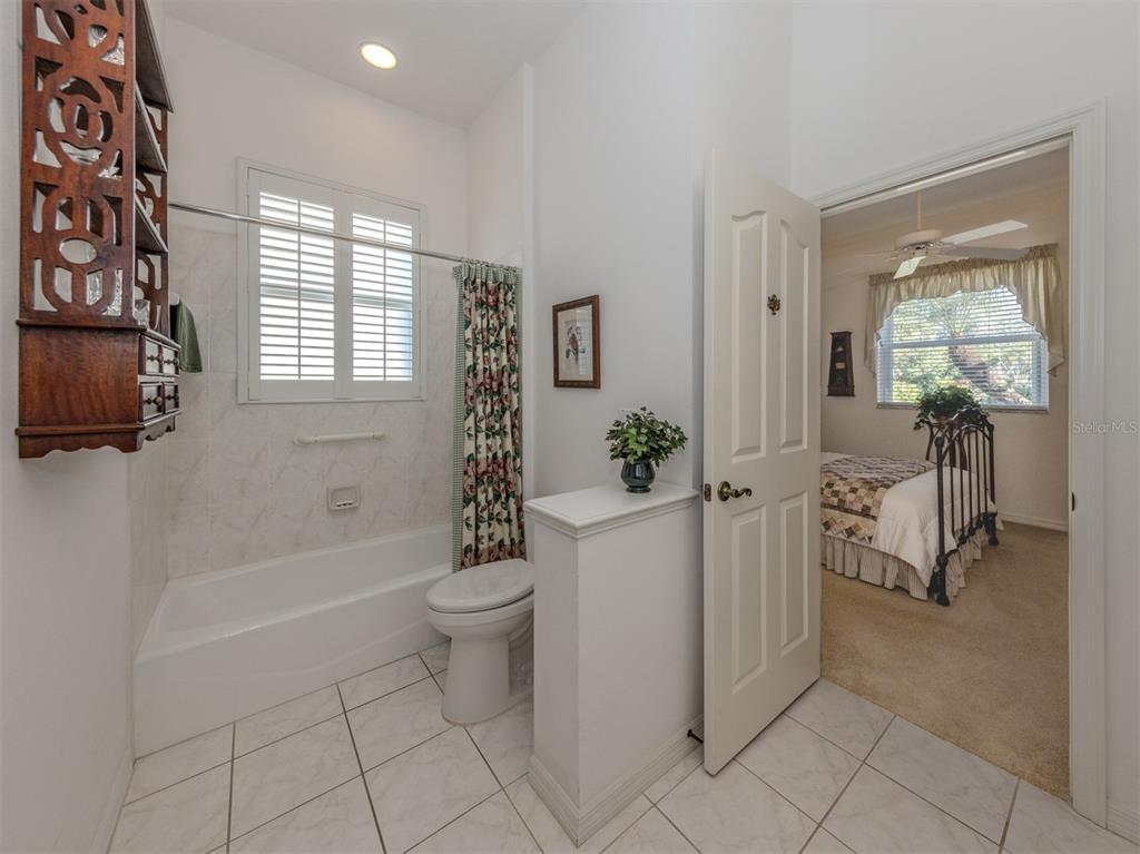 764 Sawgrass Bridge Road Venice, FL 34292 - Photo 20 of 60 a bathroom with a sink toilet and shower