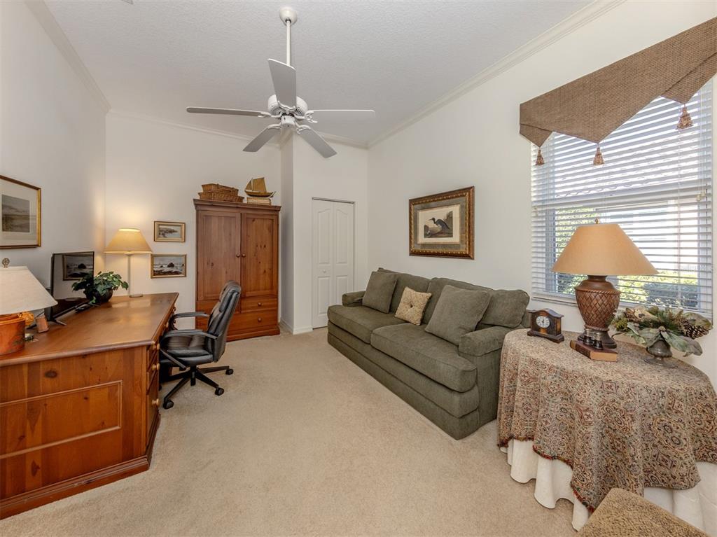 764 Sawgrass Bridge Road Venice, FL 34292 - Photo 21 of 60 a living room with furniture a couch and a window