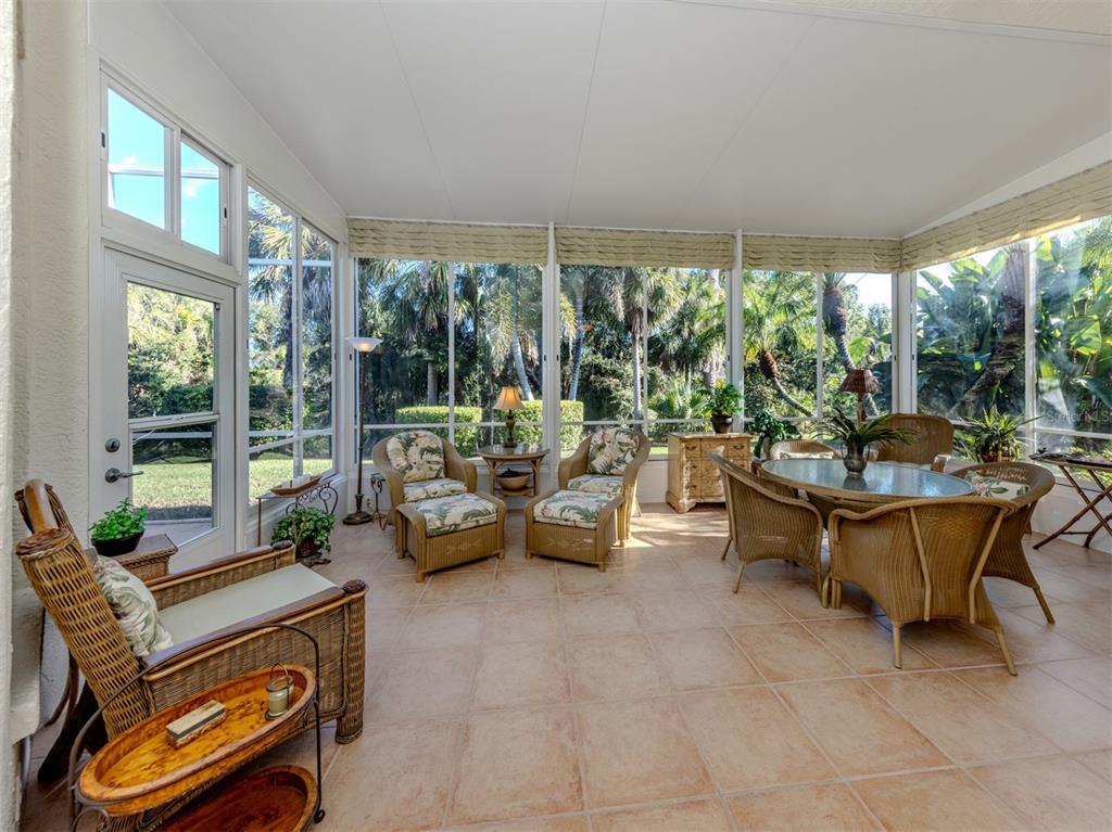 764 Sawgrass Bridge Road Venice, FL 34292 - Photo 23 of 60 a living room with furniture and a large window