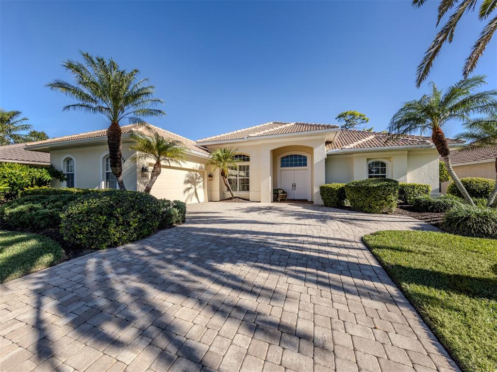 764 Sawgrass Bridge Road Venice, FL 34292 - Photo 30 of 60 a front view of a house with a garden