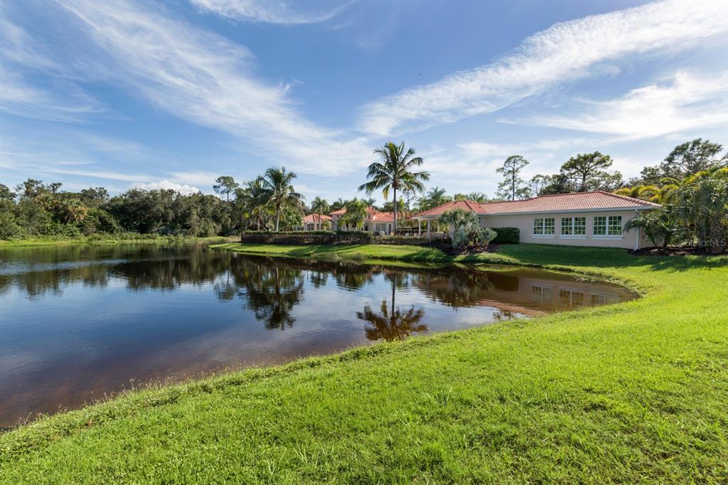 764 Sawgrass Bridge Road Venice, FL 34292 - Photo 33 of 60 a view of a lake with houses in the back