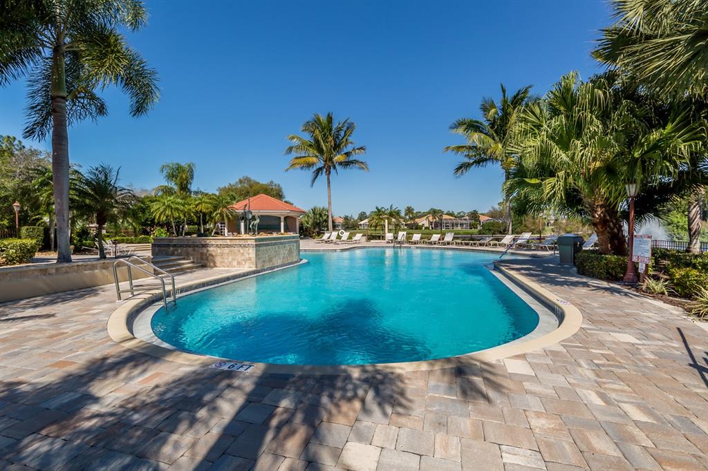 764 Sawgrass Bridge Road Venice, FL 34292 - Photo 35 of 60 a swimming pool with outdoor seating and yard