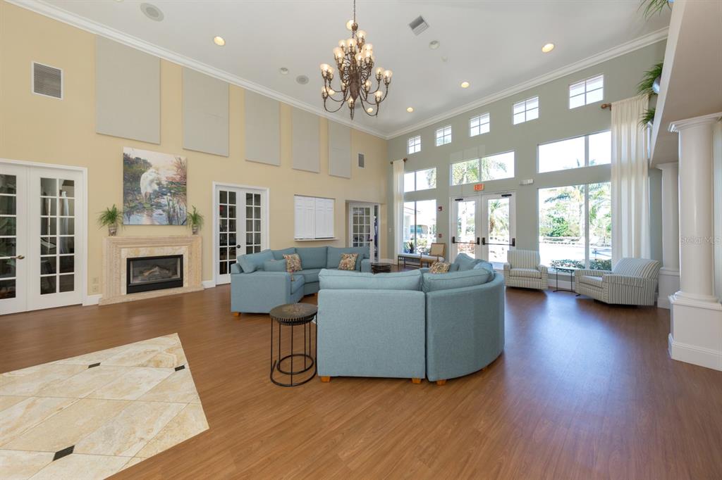 764 Sawgrass Bridge Road Venice, FL 34292 - Photo 37 of 60 a living room with furniture and a fireplace