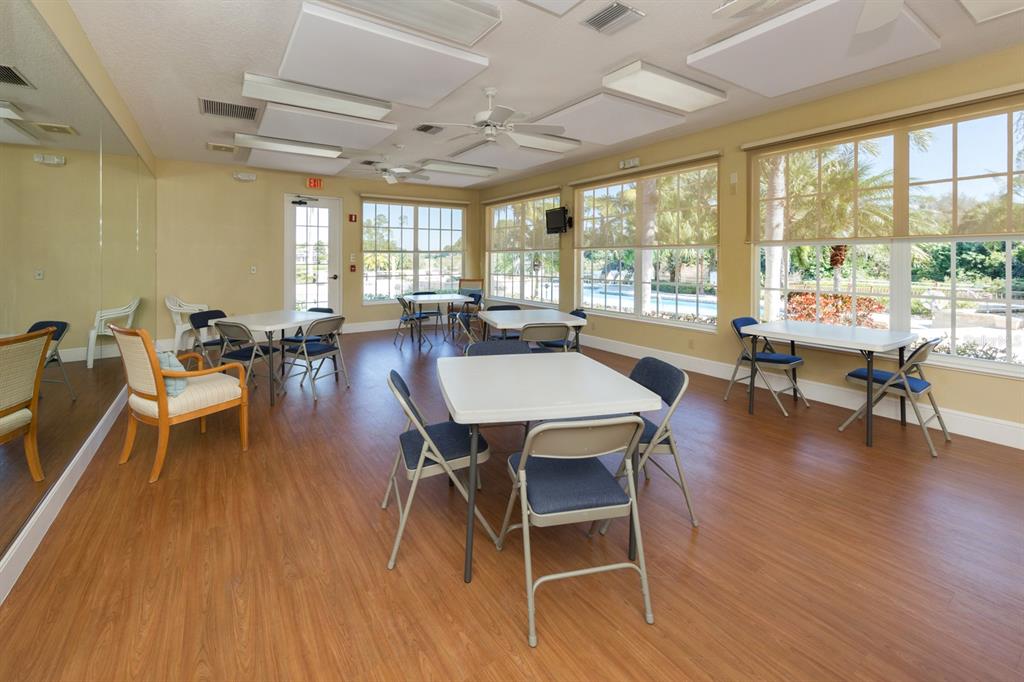 764 Sawgrass Bridge Road Venice, FL 34292 - Photo 39 of 60 a view of a dining room with furniture window and wooden floor