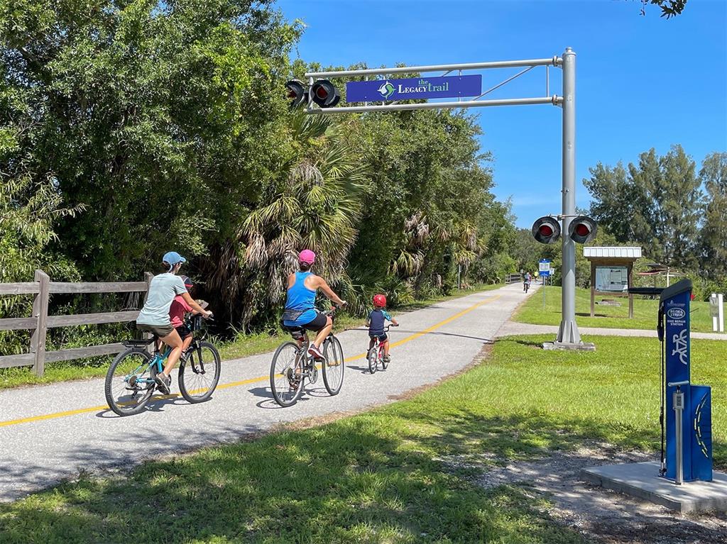 764 Sawgrass Bridge Road Venice, FL 34292 - Photo 53 of 60 a view of a park with swings and slides